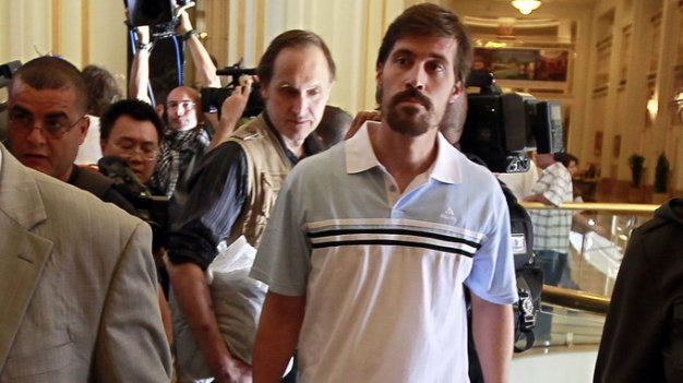 U.S. journalist James Foley (R) arrives with fellow reporter Clare Gillis (not pictured), after being released by the Libyan government, at Rixos hotel in Tripoli, in this picture taken May 18, 2011. Islamic State militants have posted a video that purported to show the beheading of American journalist Foley in revenge for U.S. air strikes in Iraq, prompting widespread revulsion that could push Western powers into further action against the group. Foley, 40, was kidnapped on November 22, 2012, in northern Syria, according to GlobalPost. The video was posted after the U.S. resumed air strikes in Iraq in August 2014 for the first time since the end of the U.S. occupation in 2011. He had earlier been kidnapped and released in Libya. Picture taken May 18, 2011. REUTERS/Louafi Larbi (LIBYA - Tags: POLITICS CIVIL UNREST CRIME LAW TPX IMAGES OF THE DAY)