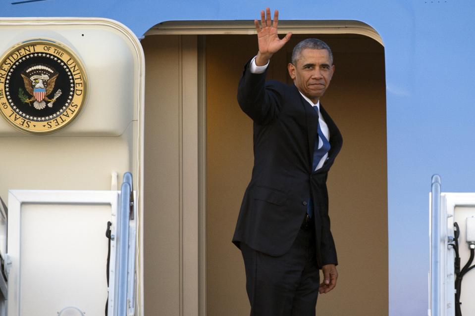 President Barack Obama waves as he boards Air Force One for a trip to Kenya and Ethiopia, on Thursday, July 23, 2015, at Andrews Air Force Base, Md. Obama is the first sitting U.S. president to visit both countries. (AP Photo/Cliff Owen)